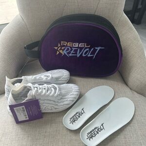 Brand new with tags Rebel Revolt cheer shoes with bag. Size Y1
